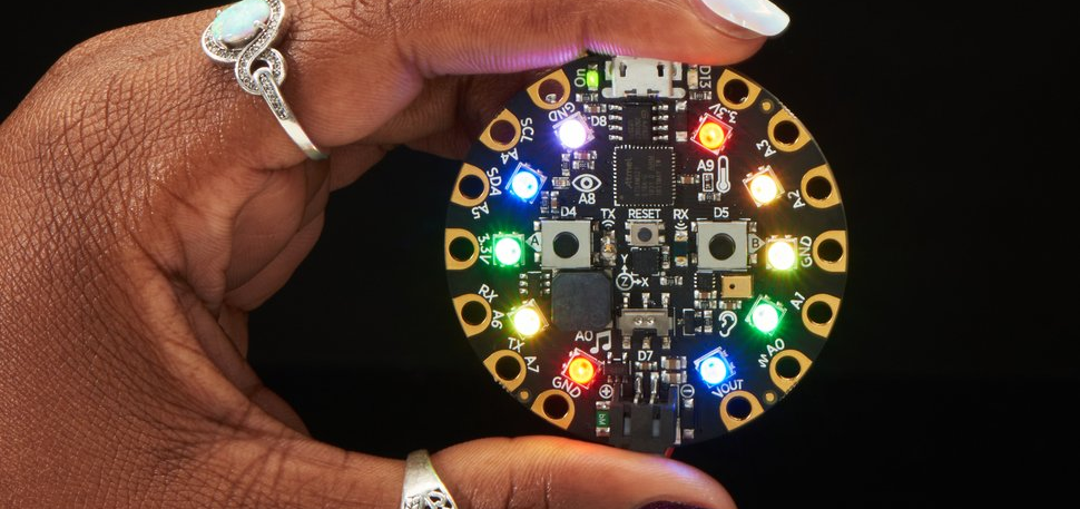 Hand holding a Circuit Express Playground board